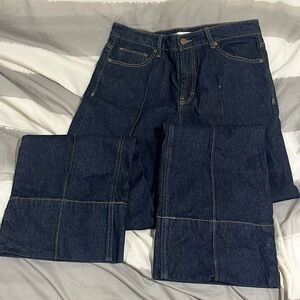 Wide leg dark wash denim jeans with front seam